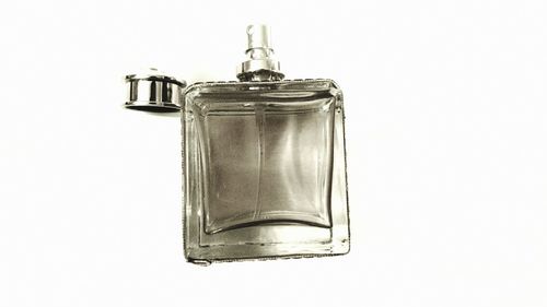 Close-up of wineglass against white background