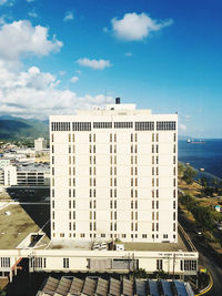 High angle view of building against cloudy sky