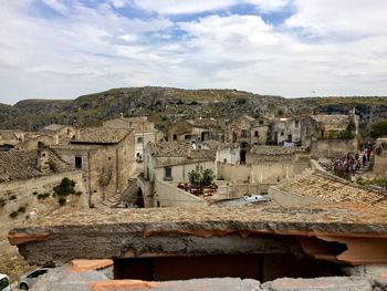 Ruins of building against cloudy sky