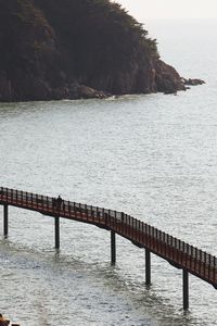 Pier over sea against sky