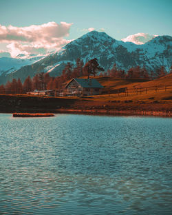 Scenic view of lake and mountains against sky