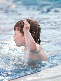 Young woman swimming in pool