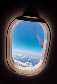 Aerial view of sky seen through airplane window