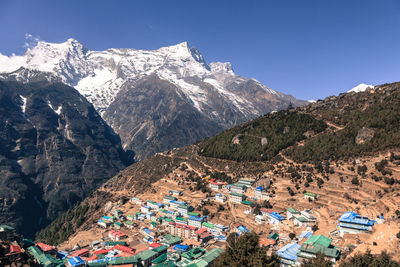 Scenic view of mountains against clear blue sky