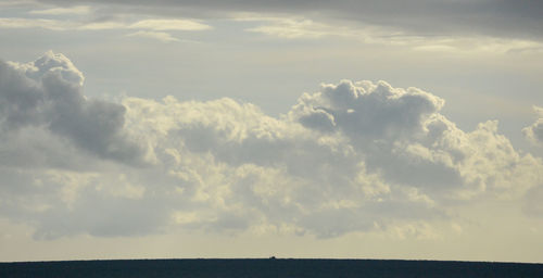 Scenic view of cloudscape over sea against sky