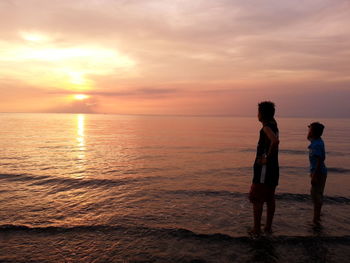 Silhouette of man standing on beach