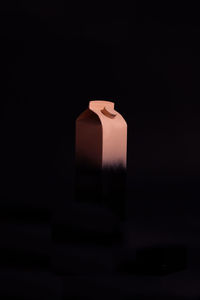 Close-up of smoke stack against black background