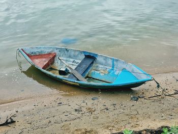 High angle view of abandoned boat moored on shore