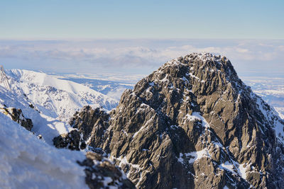 Panoramic view of snowcapped mountains against sky