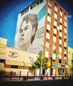 Low angle view of man against building in city