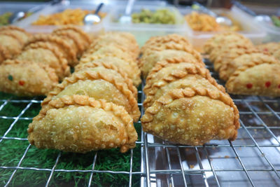 Close-up of bread on metal grate