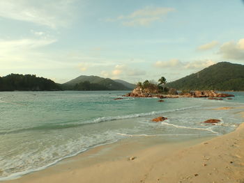 Scenic view of beach against sky