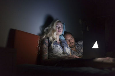Women sitting on bed at home