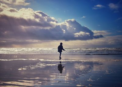 Man on beach against sky