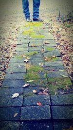 Low section of people standing on footpath