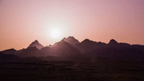 Scenic view of mountains at sunset