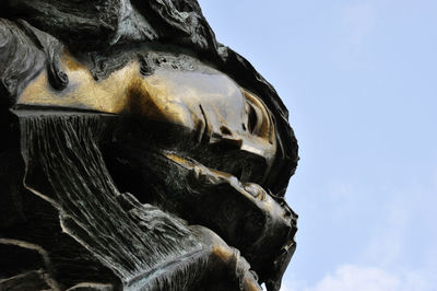 Low angle view of statue against sky