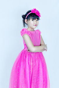 Portrait of a girl against pink background