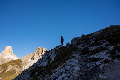 Low angle view of mountain against clear blue sky