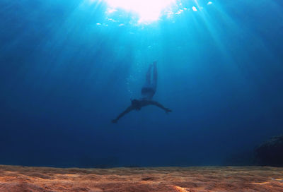 Person swimming in sea