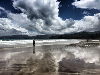 Scenic view of sea against cloudy sky