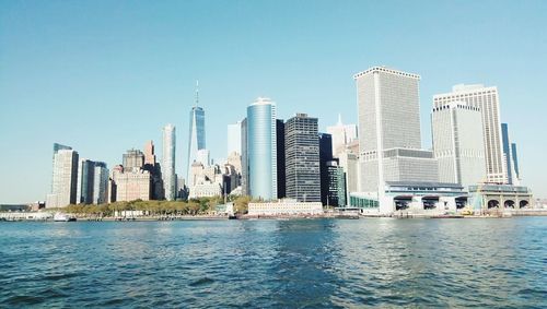 Sea with skyscrapers in background