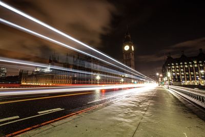 Light trails on westminster bridge by big ben at night