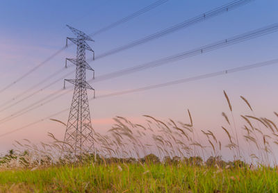 Low angle view of electricity pylon against sky