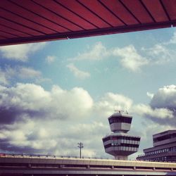 Low angle view of built structure against cloudy sky