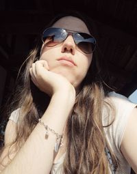 Young woman wearing sunglasses in sunny day