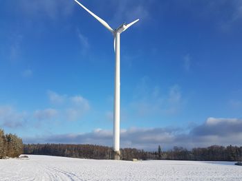 Wind turbine against sky