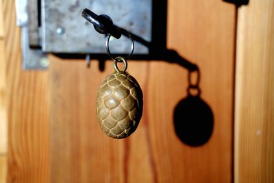 Close-up of electric lamp hanging on door