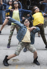 Boy playing with arms raised