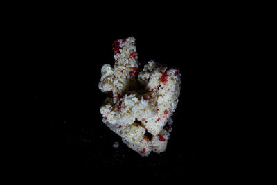 Close-up of ice cream over black background