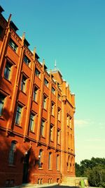 Low angle view of building against clear blue sky