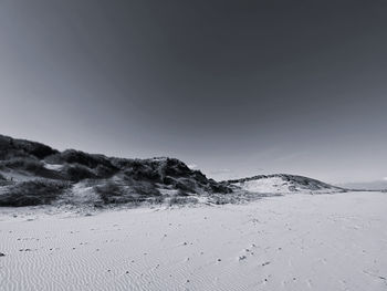 Scenic view of beach against clear sky