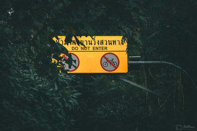 Close-up of warning sign on ground