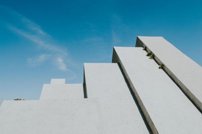 Low angle view of building against blue sky