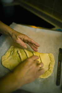 Close-up of person preparing food at home