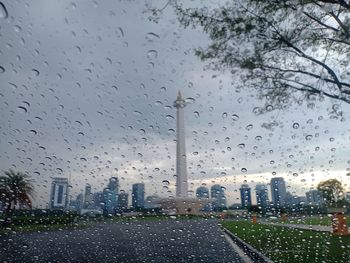 Raindrops on glass window during rainy season