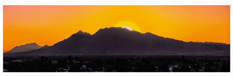 Scenic view of mountains at sunset