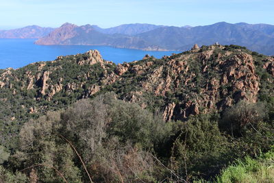 Panoramic shot of sea and mountains against sky