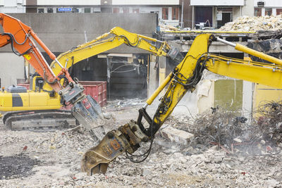Diggers demolishing buildings
