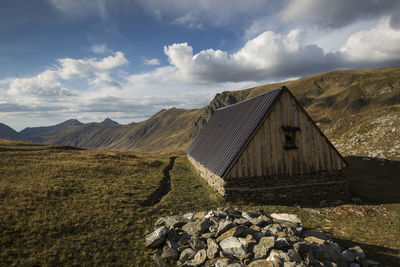 Panoramic view of land and mountains against sky