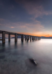 The bridge near the beach at dusk