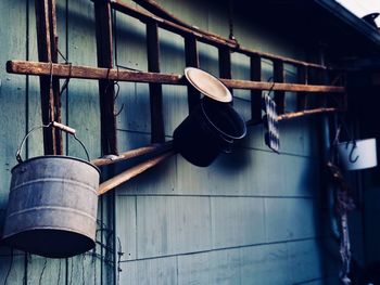 Close-up of machine part hanging on metal wall