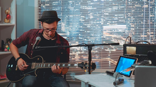 Young man playing guitar