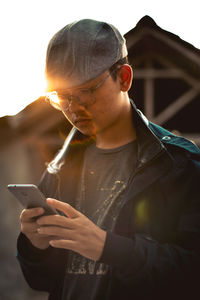 Young man using mobile phone