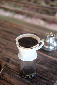 Close-up of coffee cup on table
