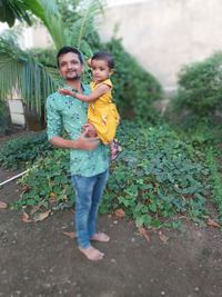 Full length portrait of boy standing outdoors